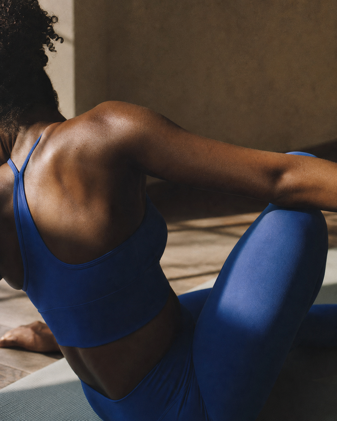 An athlete in a quiet post-training stretch